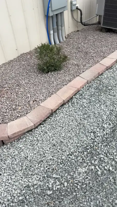 Block edging and decorative rock from JB’s completed retaining wall job